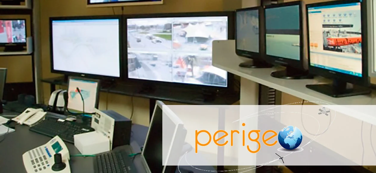 Perigeo control room with multiple monitors showing surveillance footage, highlighting UAV technology advancements.