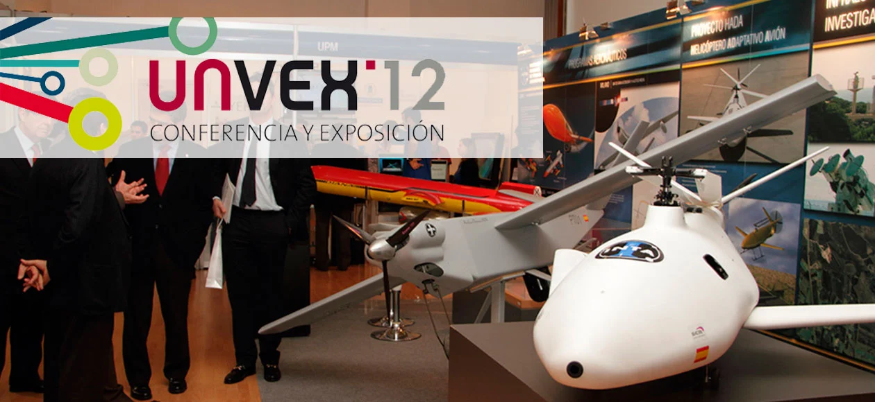 Exhibit at UNVEX 2012 featuring unmanned aerial vehicles (UAVs) and industry discussions.