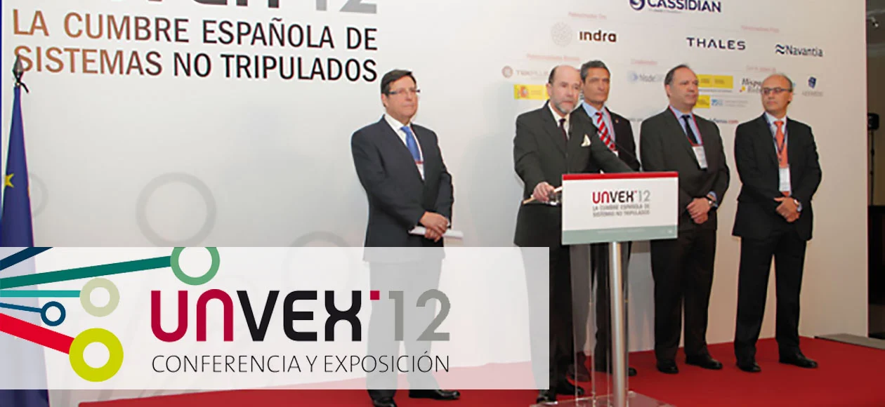 UNVEX 2012 conference, with industry leaders on stage discussing unmanned systems in Spain.