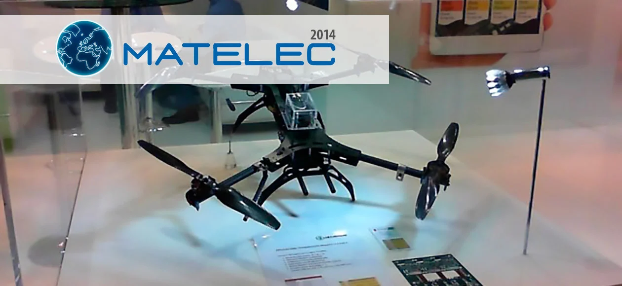 Display of a quadcopter drone under bright lights at the MATELEC 2014 exhibition, showcasing cutting-edge electronic innovations.