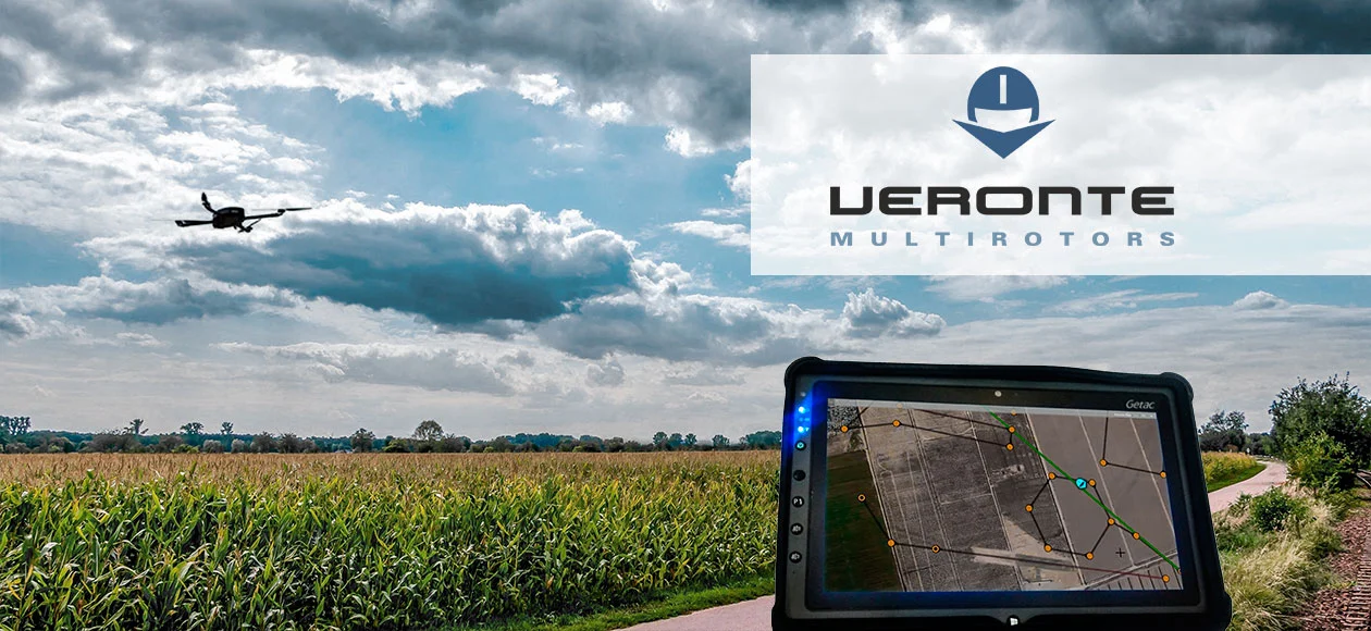 Drone flying over a crop field with a navigation screen showing map and flight path.