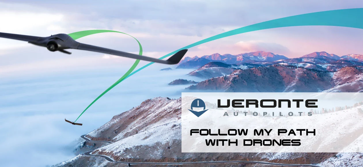 Drone following a path over snowy mountain peaks, showing navigation capabilities.