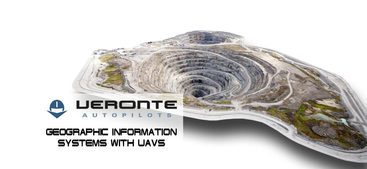 A drone's perspective of a large, terraced mine, featuring Veronte autopilots for GIS applications.