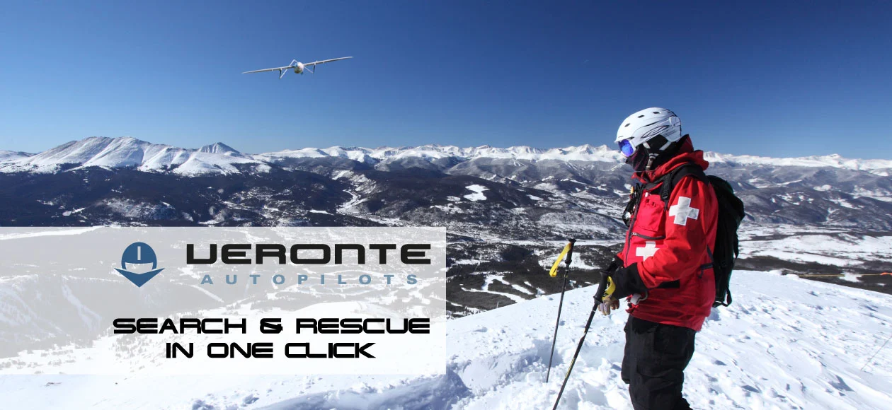 Drone flying over snowy mountains with a rescuer watching, branded with Veronte autopilots.