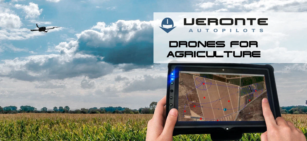 A drone flying over a farm, with a tablet displaying a mapped field for precision agriculture using Veronte autopilots.
