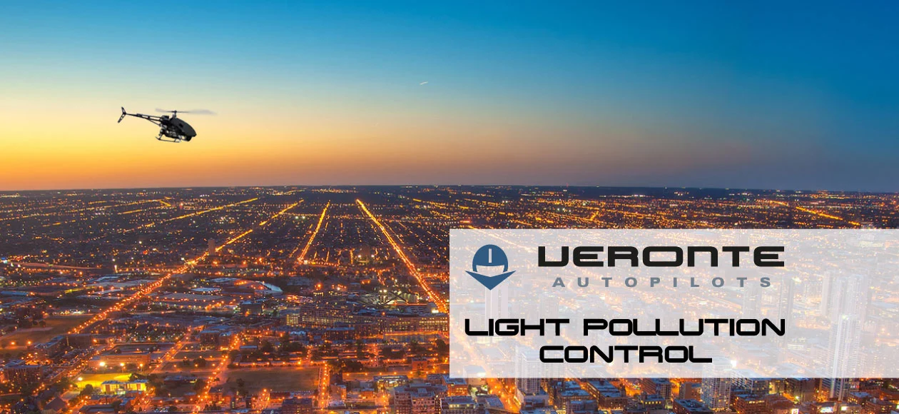 Drone flying over a city at dusk, highlighting light pollution control efforts by Veronte Autopilots.