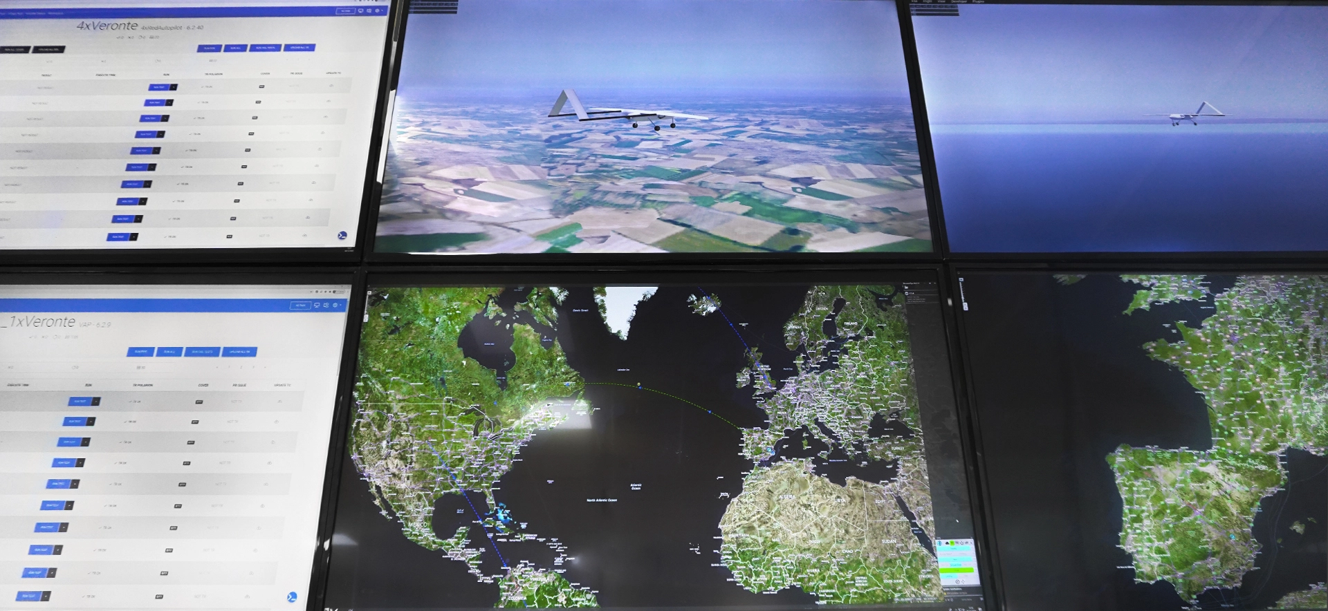Control room with multiple screens displaying UAV flight simulations and real-time data analytics.