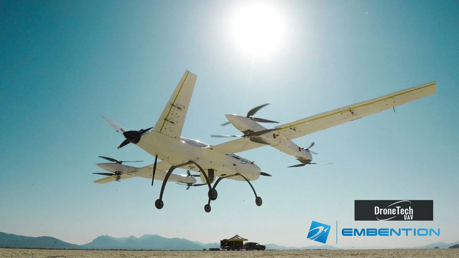 View of a light aircraft taking off from the ground with the sky in the background.